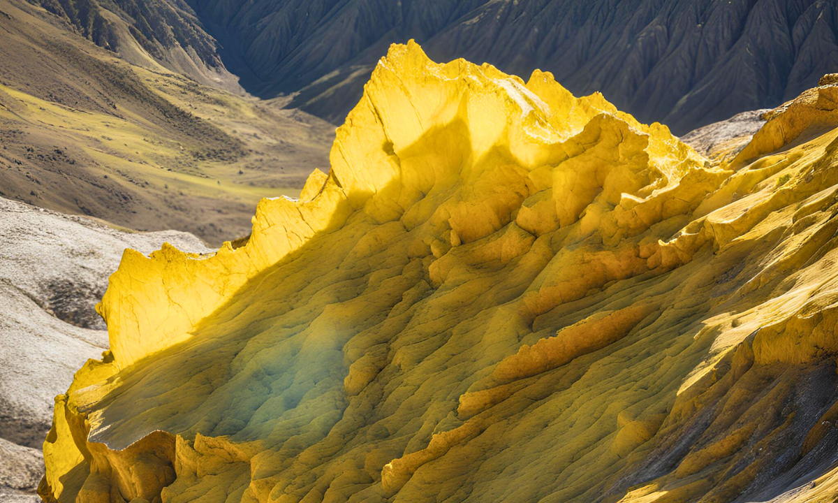 Bright yellow sulfur deposits on a rocky mountainside